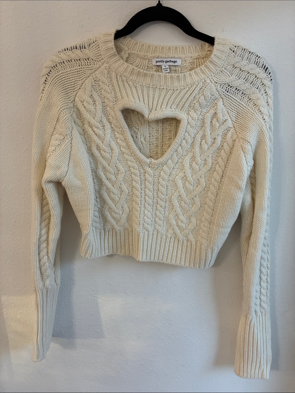 Pretty Garbage Cream Cable-Knit Heart Cutout Crewneck Sweater